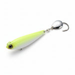 Fishing lure with a green body and silver spoon on a white background